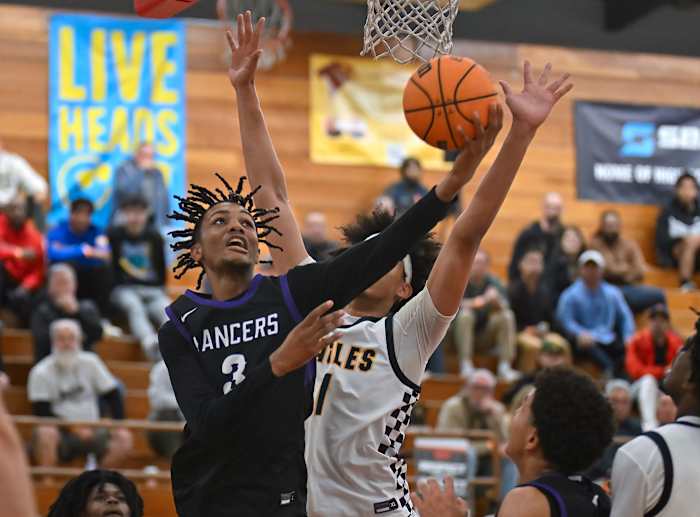 Jael Martin (3) goes in for a tough left-hand layup.